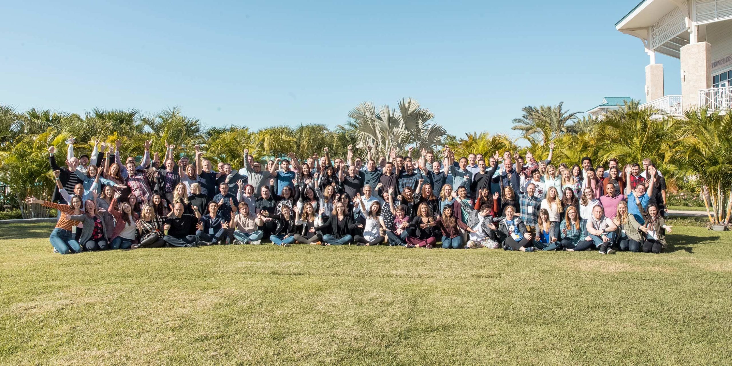 team photo of AdThrive employees outside on a grassy field