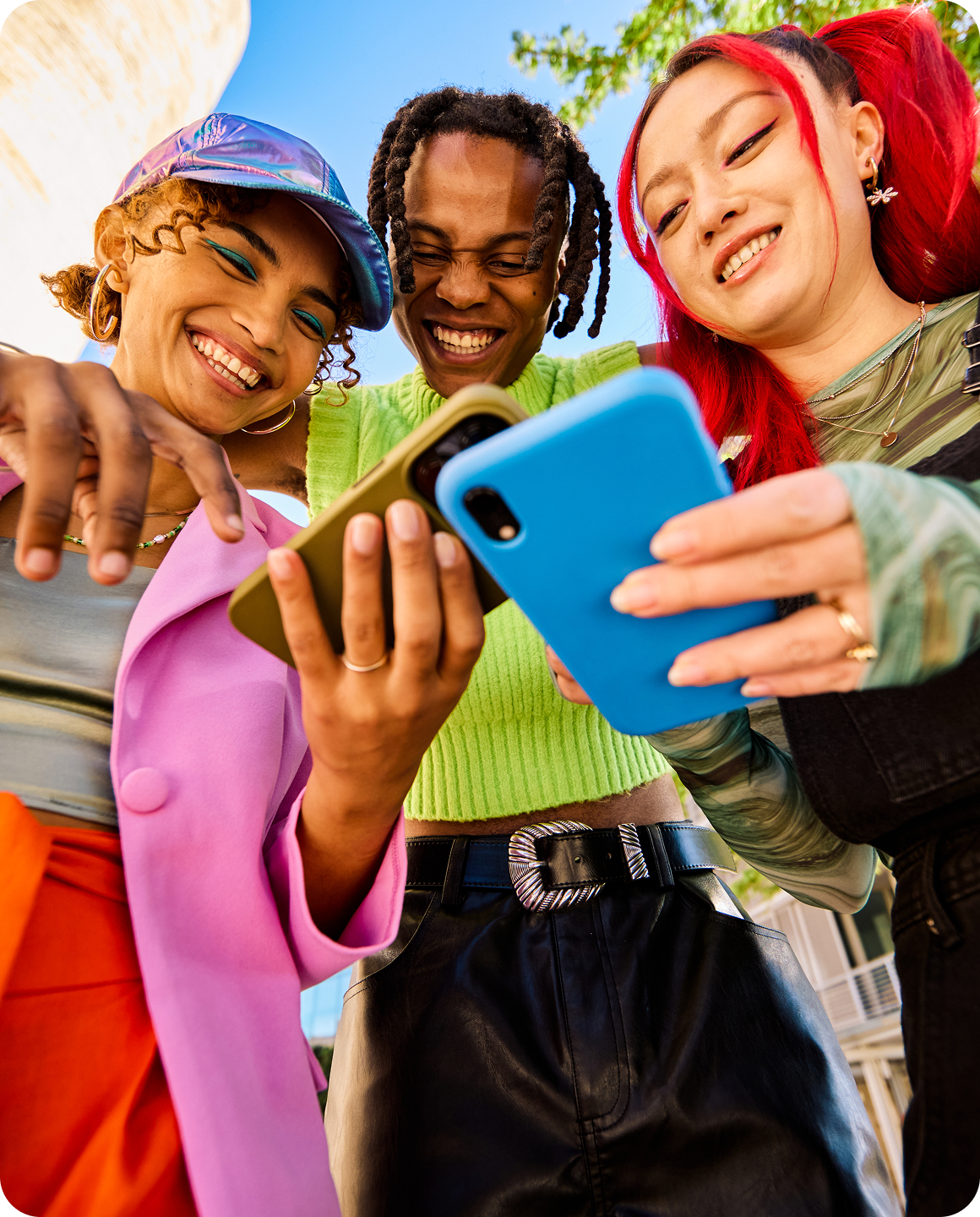 Creators gathered around a phone and smiling
